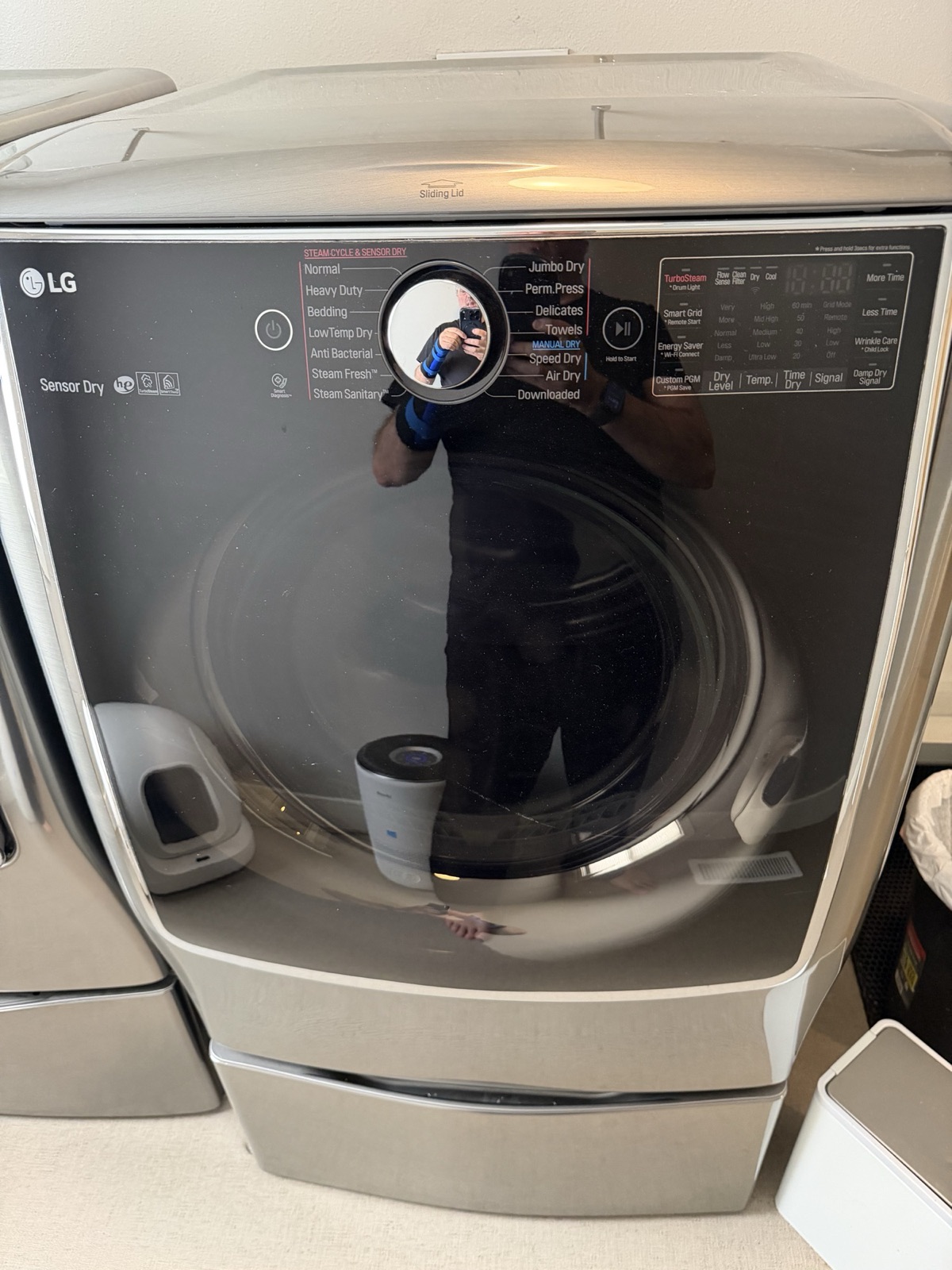 LG dryer on-door control panel showing Steam Cycle & Sensor Dry options, Jumbo Dry, TurboSteam, and Smart Diagnosis.